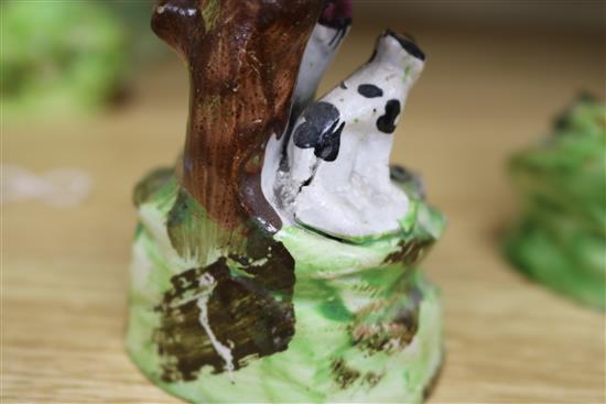 A Walton pottery sheep and lamb spill vase, two Staffordshire pottery cow and calf groups & a Staffordshire of a youth and his dog (4)